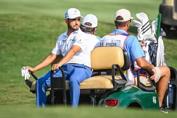 Abraham Ancer of Mexico rides in a cart to the 18th hole tee for a playoff during the final round of the World Golf Championships-FedEx St. Jude...