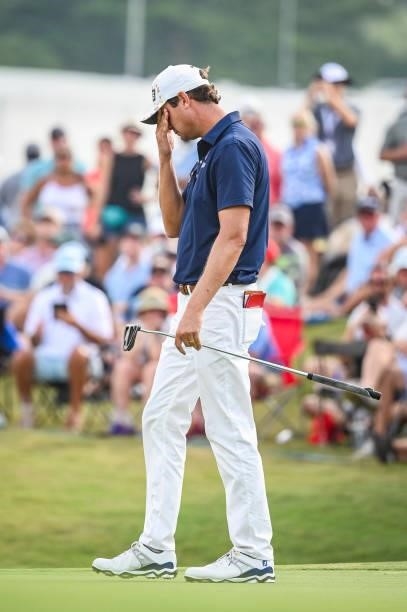Harris English reacts after missing birdie putt to join a playoff on the 18th hole during the final round of the World Golf Championships-FedEx St....
