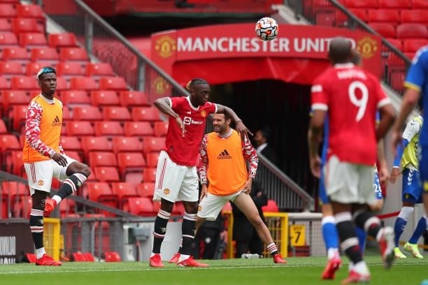 Paul Pogba of Manchester United warms up as he watches the match during the Pre Season Friendly fixture between Manchester United and Everton at Old...