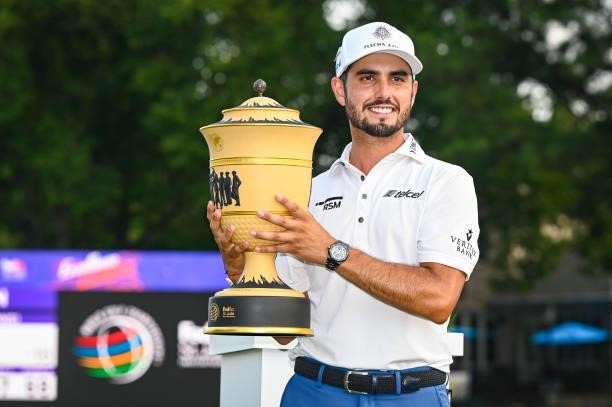 Abraham Ancer of Mexico smiles with the Gary Player Cup trophy following his playoff victory in the final round of the World Golf Championships-FedEx...