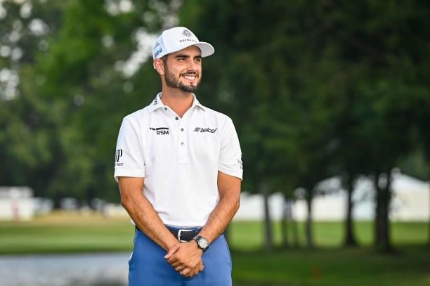 Abraham Ancer of Mexico smiles during the trophy ceremony following his playoff victory in the final round of the World Golf Championships-FedEx St....