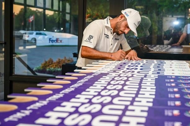 Abraham Ancer of Mexico signs Hush Yall signs following his playoff victory in the final round of the World Golf Championships-FedEx St. Jude...
