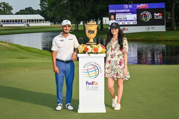 Abraham Ancer of Mexico and his girlfriend Nicole Curtright smile with the Gary Player Cup trophy following his playoff victory in the final round of...