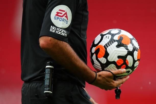 Referee Martin Atkinson holds the Official Premier League Nike Strike Aerowsculpt 21/22 match ball during the Pre Season Friendly fixture between...