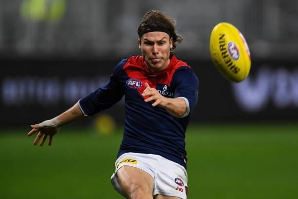 Ed Langdon of the Demons kicks the ball during the 2021 AFL Round 21 match between the West Coast Eagles and the Melbourne Demons at Optus Stadium on...