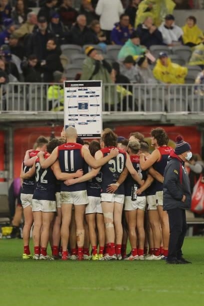 Simon Goodwin, Senior Coach of the Demons addresses the team at three quarter time break during the 2021 AFL Round 21 match between the West Coast...