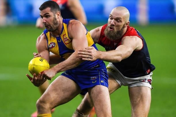 Jack Darling of the Eagles is tackled by Max Gawn of the Demons during the 2021 AFL Round 21 match between the West Coast Eagles and the Melbourne...