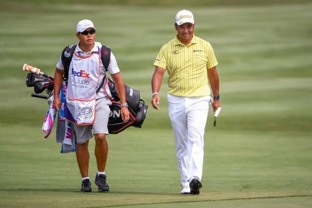 Hideki Matsuyama of Japan smiles at the 18th green during the final round of the World Golf Championships-FedEx St. Jude Invitational at TPC...