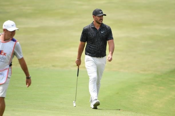 Brooks Koepka walks up to the ninth green during the final round of the World Golf Championships-FedEx St. Jude Invitational at TPC Southwind on...