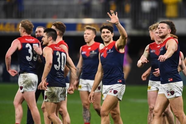 Christian Petracca of the Demons celebrates with the fans during the 2021 AFL Round 21 match between the West Coast Eagles and the Melbourne Demons...
