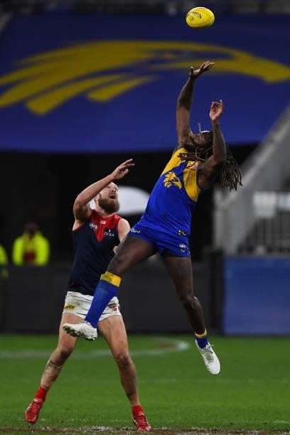 Nic Naitanui of the Eagles competes in a ruck contest with Max Gawn of the Demons during the 2021 AFL Round 21 match between the West Coast Eagles...