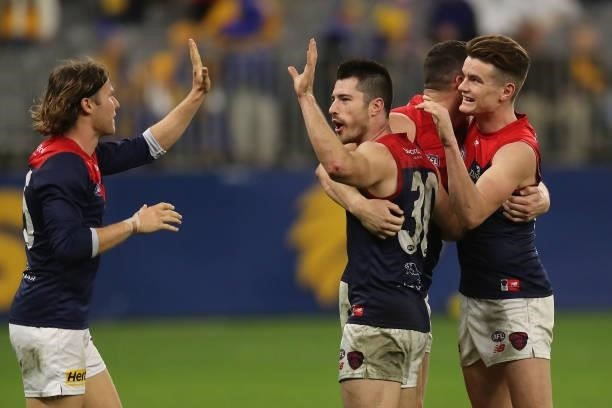 Alex Neal-Bullen of the Demons celebrate after the teams win during the 2021 AFL Round 21 match between the West Coast Eagles and the Melbourne...