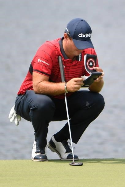 Patrick Reed at the ninth green with his yardage book during the final round of the World Golf Championships-FedEx St. Jude Invitational at TPC...