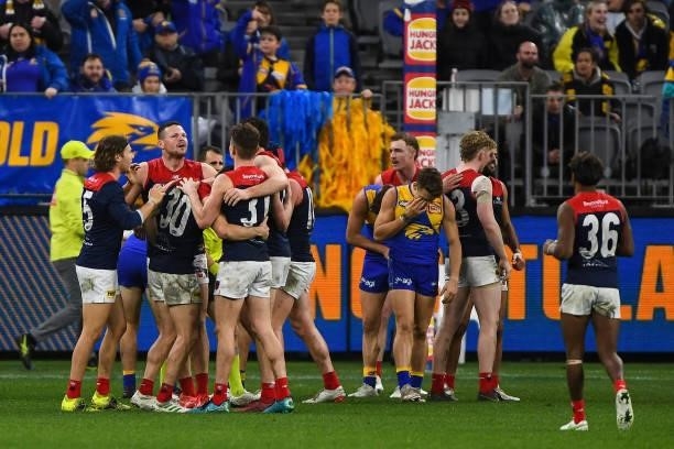 The Demons celebrate the win on the final siren during the 2021 AFL Round 21 match between the West Coast Eagles and the Melbourne Demons at Optus...