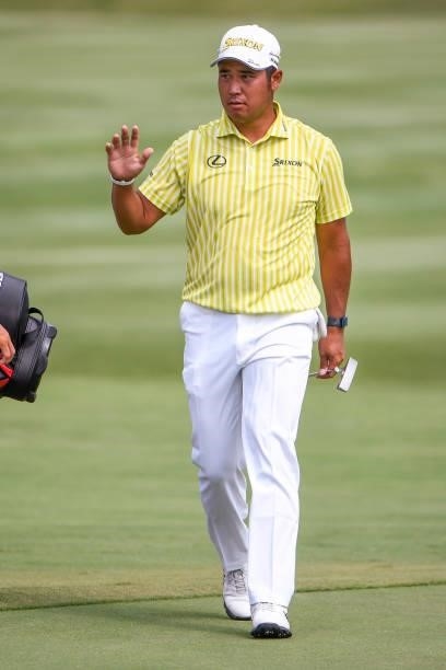 Hideki Matsuyama of Japan waves at the 18th green during the final round of the World Golf Championships-FedEx St. Jude Invitational at TPC Southwind...