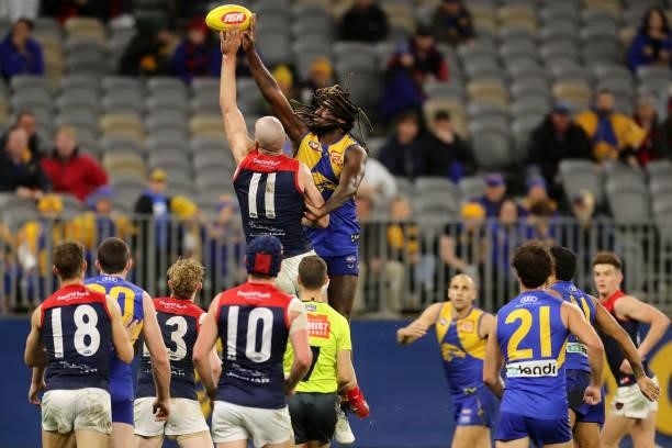 Max Gawn of the Demons and Nic Naitanui of the Eagles in action during the 2021 AFL Round 21 match between the West Coast Eagles and the Melbourne...