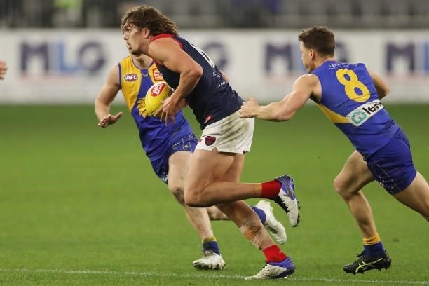 Luke Jackson of the Demons looks to pass the ball during the 2021 AFL Round 21 match between the West Coast Eagles and the Melbourne Demons at Optus...