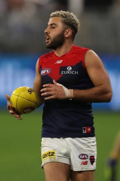 Christian Salem of the Demons looks to pass the ball during the 2021 AFL Round 21 match between the West Coast Eagles and the Melbourne Demons at...