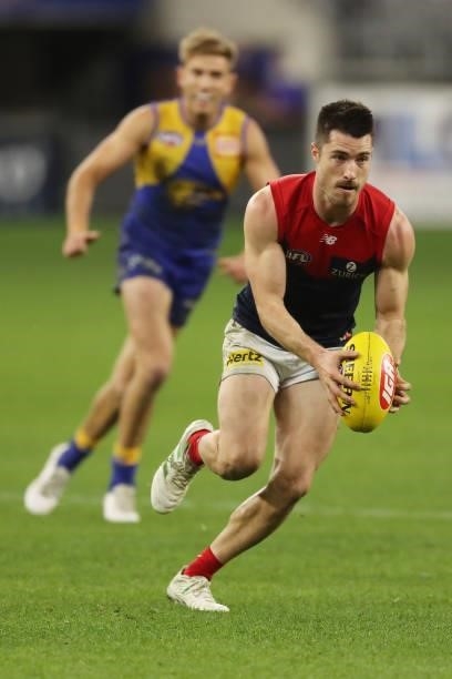 Alex Neal-Bullen of the Demons looks to pass the ball during the 2021 AFL Round 21 match between the West Coast Eagles and the Melbourne Demons at...