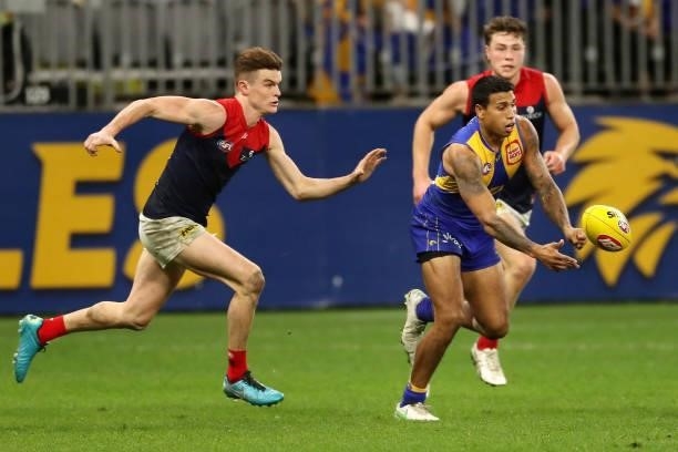 Tim Kelly of the Eagles handpasses the ball during the 2021 AFL Round 21 match between the West Coast Eagles and the Melbourne Demons at Optus...