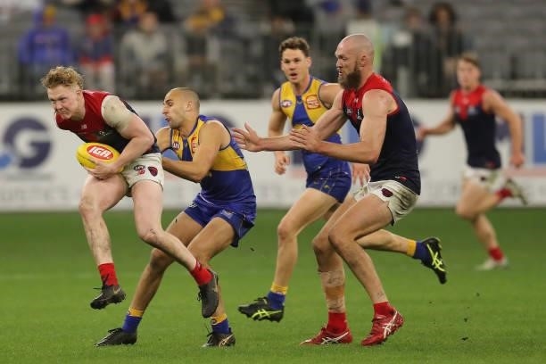 Clayton Oliver of the Demons marks the ball during the 2021 AFL Round 21 match between the West Coast Eagles and the Melbourne Demons at Optus...