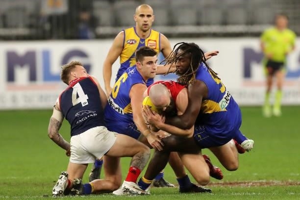 Max Gawn of the Demons is tackled by Nic Naitanui of the Eagles during the 2021 AFL Round 21 match between the West Coast Eagles and the Melbourne...