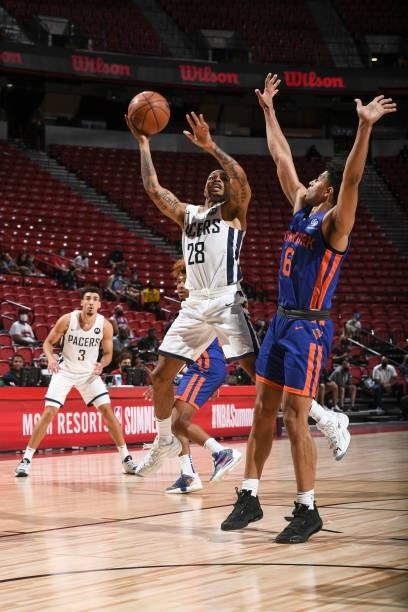 Keifer Sykes of the Indiana Pacers drives to the basket as Quentin Grimes of the New York Knicks plays defense during the 2021 Las Vegas Summer...