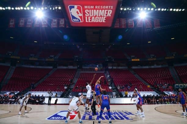 Amida Brimah of the Indiana Pacers and Jericho Sims of the New York Knicks reach for the tip off during the 2021 Las Vegas Summer League on August 9,...