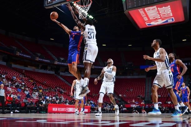 Obi Toppin of the New York Knicks drives to the basket as Amida Brimah of the Indiana Pacers plays defense during the 2021 Las Vegas Summer League on...