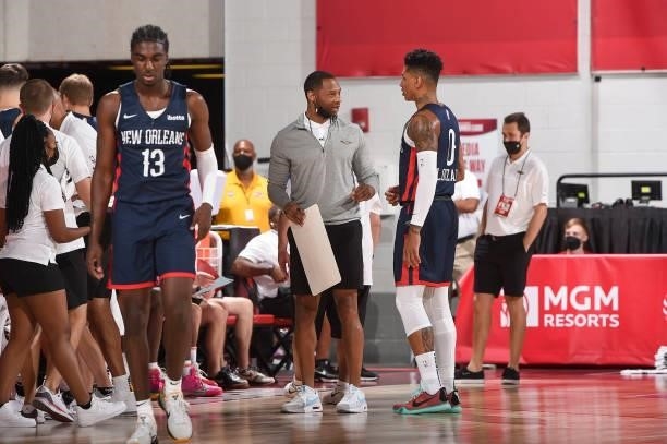 Head Coach Willie Green of the New Orleans Pelicans talks to Didi Louzada of the New Orleans Pelicans during the 2021 Las Vegas Summer League on...