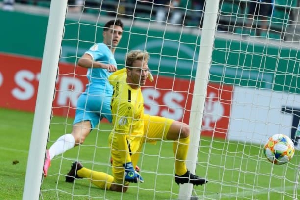 Josip Brekalo of VfL Wolfsburg scores his team's first goal during the DFB Cup first round match between Preussen Muenster and VfL Wolfsburg at...