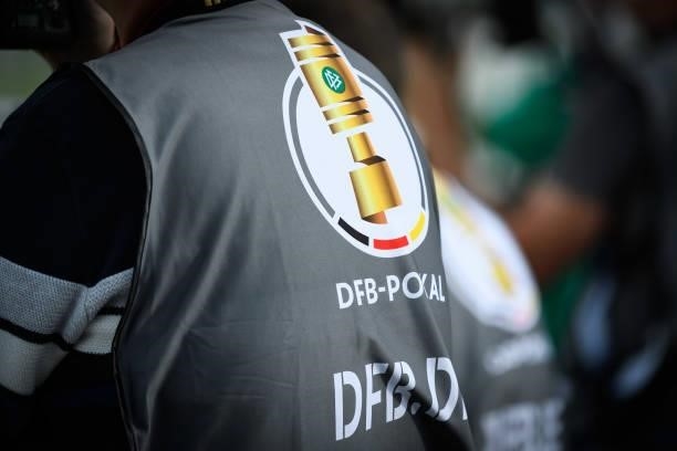 The logo of the DFB-Pokal on the photo body of a photographer during the DFB Cup first round match between Preussen Muenster and VfL Wolfsburg at...