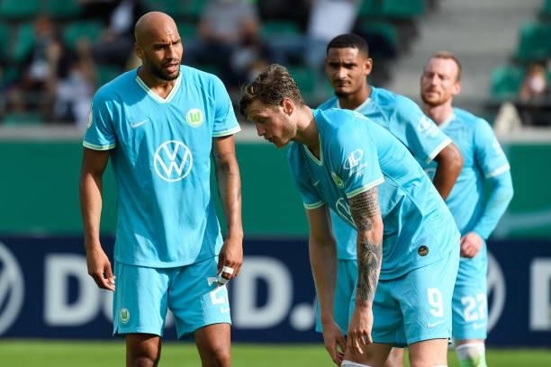John Anthony Brooks of VfL Wolfsburg and Wout Weghorst of VfL Wolfsburg discusses during the DFB Cup first round match between Preussen Muenster and...