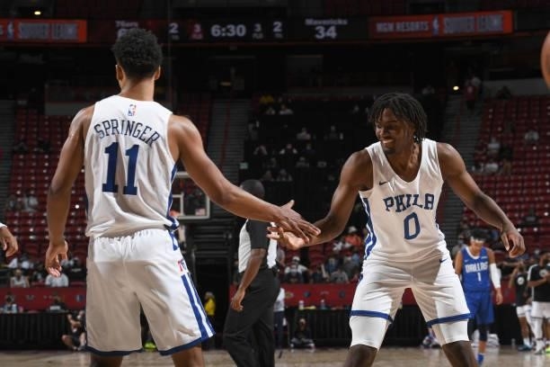 Tyrese Maxey hi-fives Jaden Springer of the Philadelphia 76ers during the game against the Dallas Mavericks during the 2021 Las Vegas Summer League...