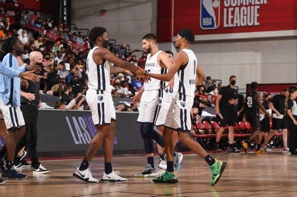 Romeo Weems of the Memphis Grizzlies high fives Killian Tillie of the Memphis Grizzlies and Ziaire Williams of the Memphis Grizzlies during the 2021...