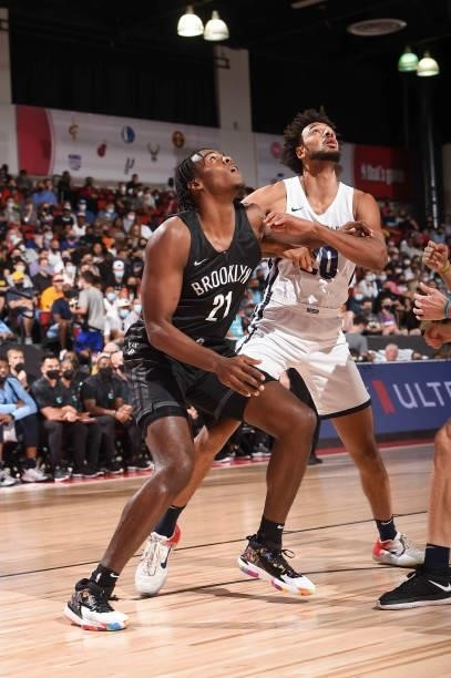 DayRon Sharpe of the Brooklyn Nets and Olivier Sarr of the Memphis Grizzlies fight for position during the 2021 Las Vegas Summer League on August 9,...