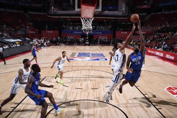 Robert Franks of the Dallas Mavericks drives to the basket during the game against the Philadelphia 76ers during the 2021 Las Vegas Summer League on...