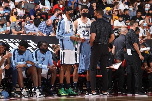 Ziaire Williams of the Memphis Grizzlies and Marko Guduric of the Memphis Grizzlies talk to a coach during the 2021 Las Vegas Summer League on August...