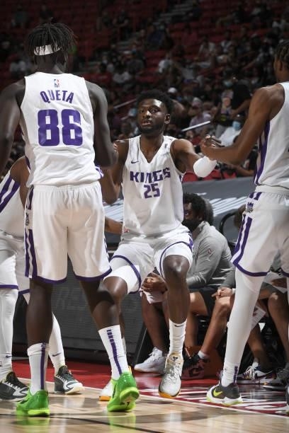 Neemias Queta helps up Chimezie Metu of the Sacramento Kings during the game against the Charlotte Hornets during the 2021 Las Vegas Summer League on...
