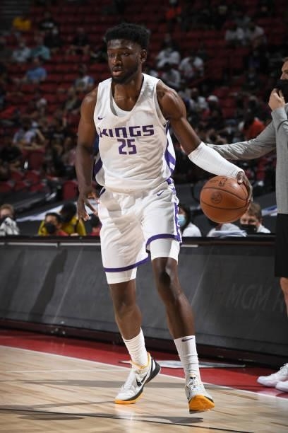 Chimezie Metu of the Sacramento Kings dribbles the ball during the game against the Charlotte Hornets during the 2021 Las Vegas Summer League on...