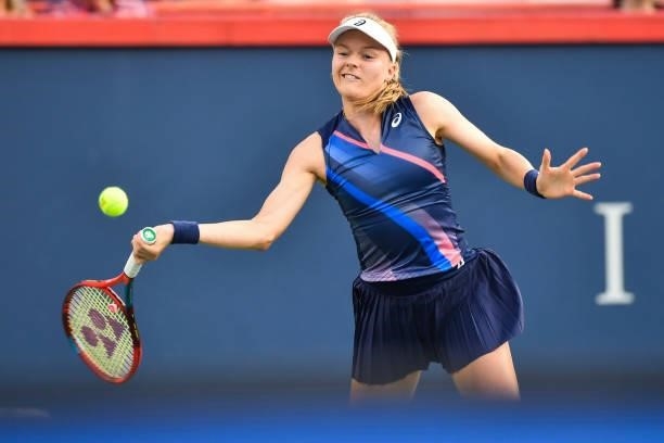 Harriet Dart of Great Britain hits a return during her Womens Singles first round match against Leylah Fernandez of Canada on Day One of the National...