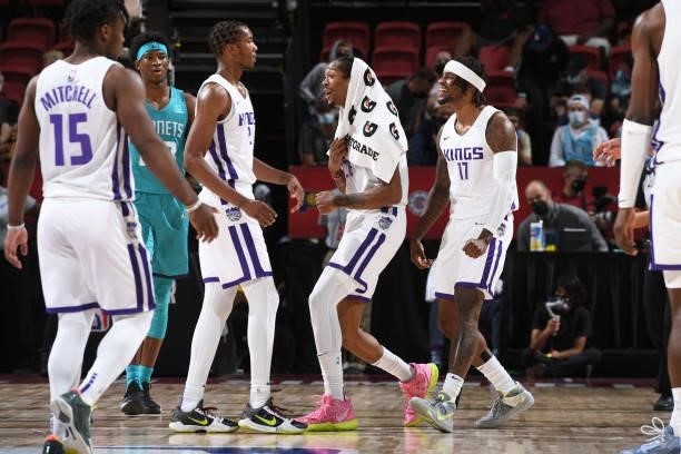 Emanuel Terry and Ade Murkey of the Sacramento Kings hi-five Louis King of the Sacramento Kings during the game against the Charlotte Hornets during...