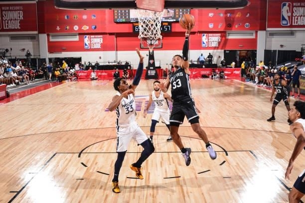Tre Jones of the San Antonio Spurs drives to the basket during the game against the Minnesota Timberwolves during the 2021 Las Vegas Summer League on...
