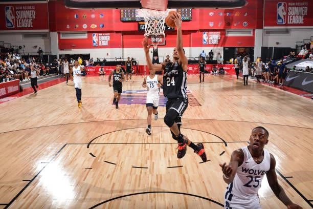 Devin Vassell of the San Antonio Spurs drives to the basket against the Minnesota Timberwolves during the 2021 Las Vegas Summer League on August 9,...
