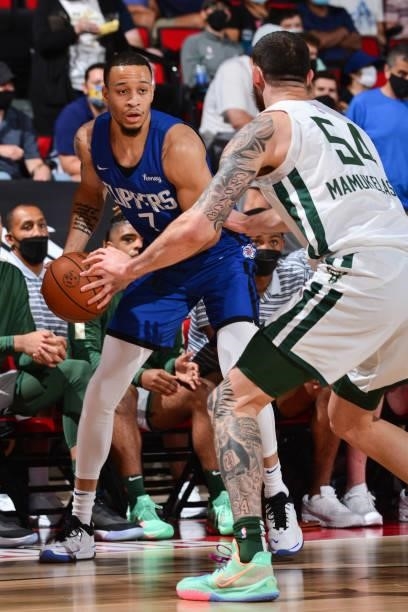 Amir Coffey of the LA Clippers looks to pass the ball against the Milwaukee Bucks during the 2021 Las Vegas Summer League on August 9, 2021 at the...