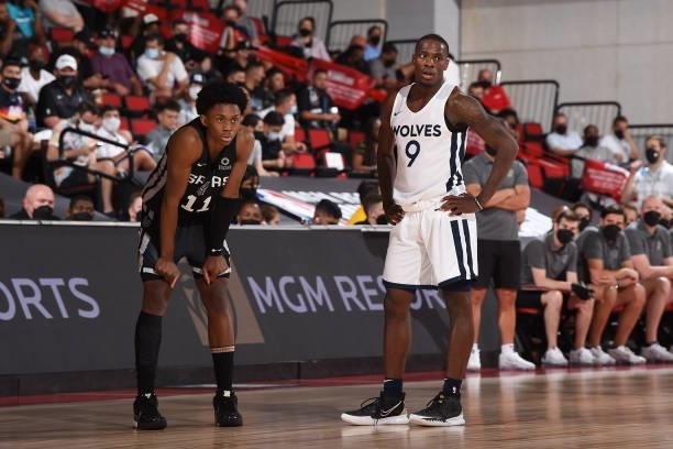 Josh Primo of the San Antonio Spurs and Isaiah Miller of the Minnesota Timberwolves look on during the 2021 Las Vegas Summer League on August 9, 2021...