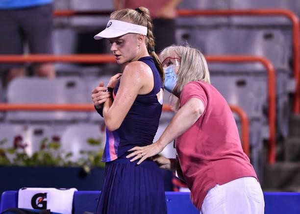 Harriet Dart of Great Britain receives medical attention during her Womens Singles first round match against Leylah Fernandez of Canada on Day One of...