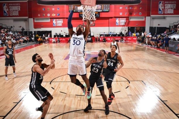 Nathan Knight of the Minnesota Timberwolves dunks the ball against the San Antonio Spurs during the 2021 Las Vegas Summer League on August 9, 2021 at...