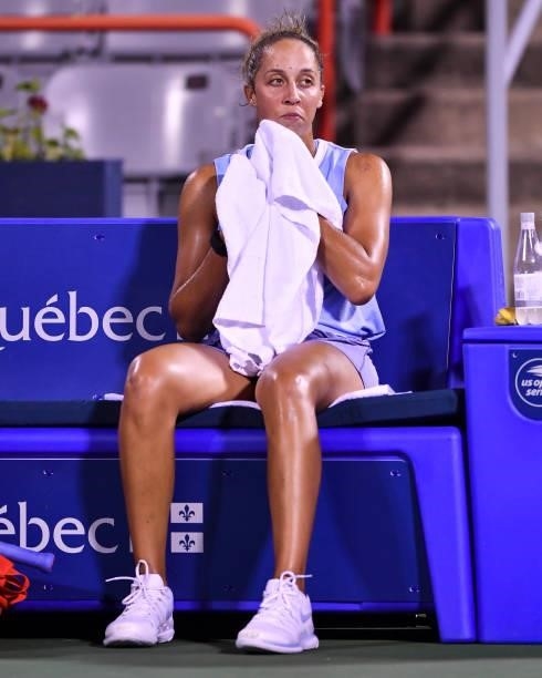 Madison Keys of the United States wipes herself down during her Womens Singles first round match against Rebecca Marino of Canada on Day One of the...