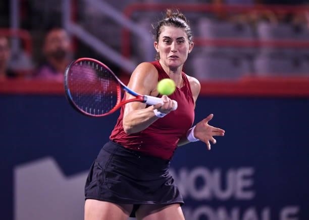 Rebecca Marino of Canada hits a return during her Womens Singles first round match against Madison Keys of the United States on Day One of the...